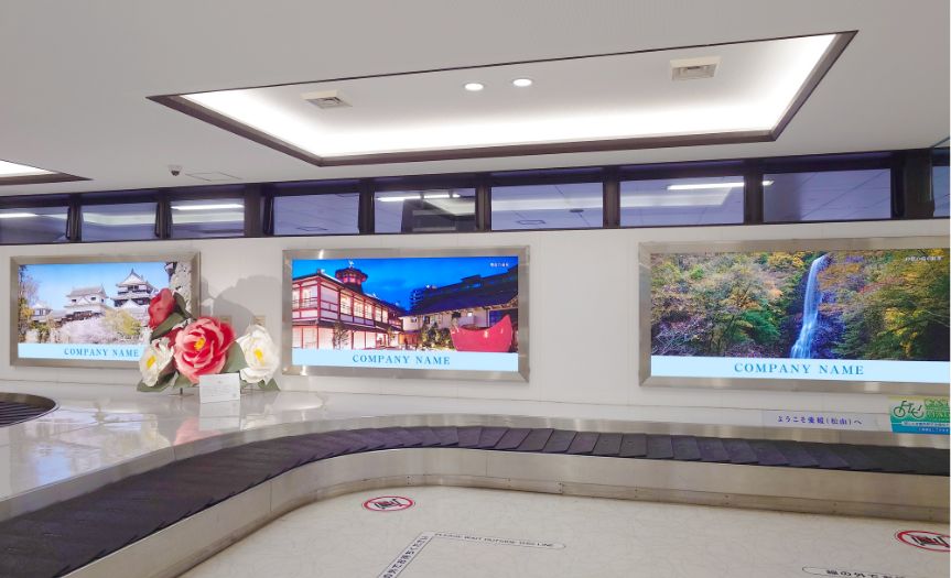 社名広告：国内線1F手荷物受取所の写真